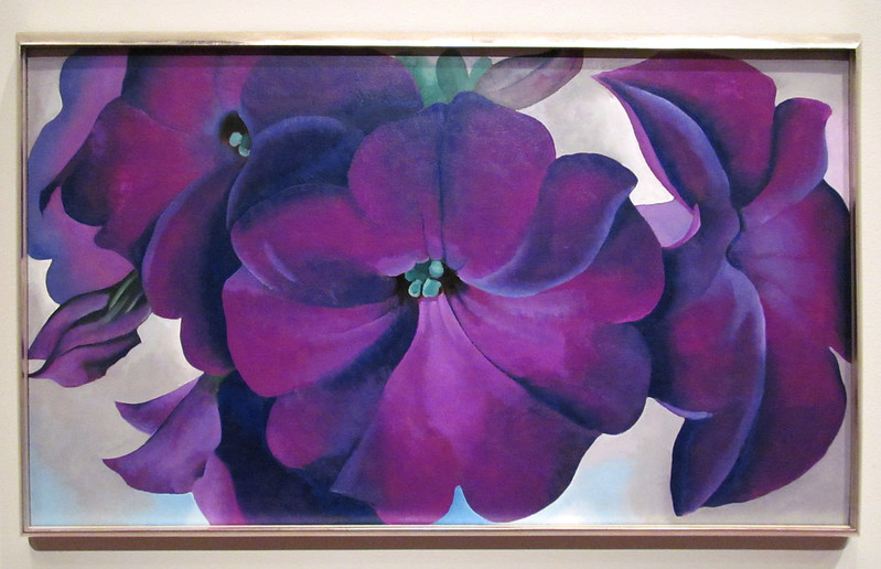 large close-up painting of purple petunias