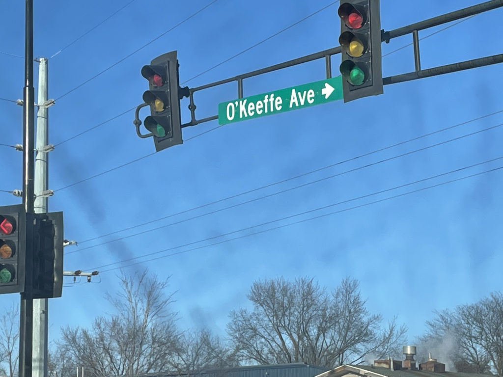 Green street sign for O'Keeffe Avenue